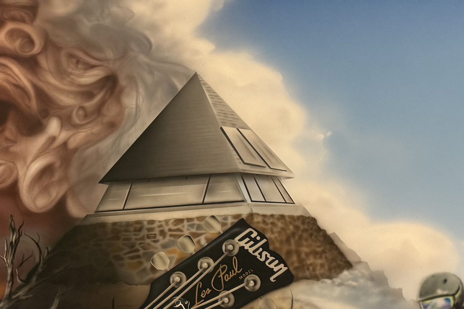 The pyramid-roofed house at Mt Buller with a Les Paul headstock beside it