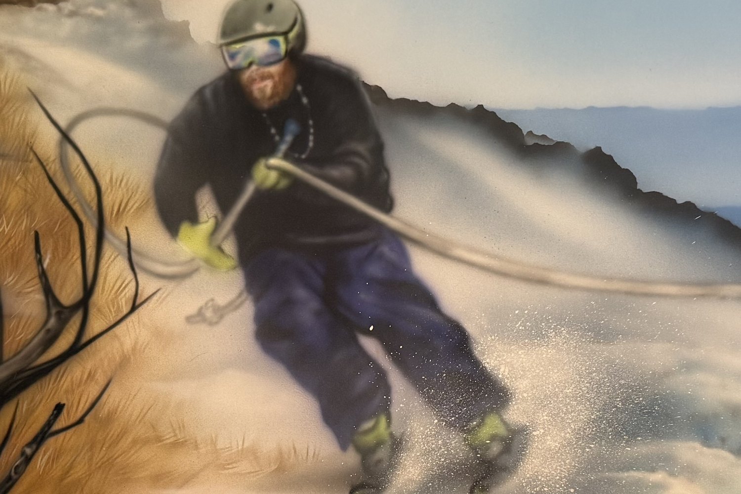Mark skiing on a tow rope with snow spraying behind him